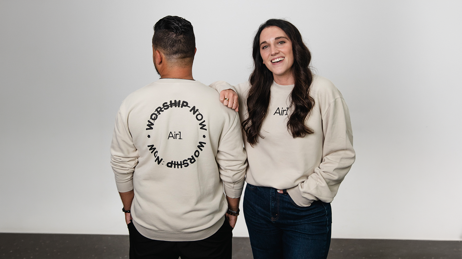 Two models posing in Air1 Merchandise
